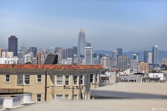 a view of a city with tall buildings