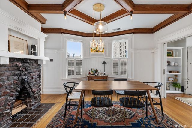 a dining room with furniture and window