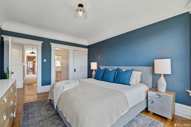 a bedroom with a bed and a lamp