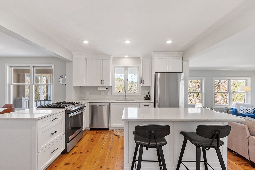 4 Willow Road Harvard, MA 01451 - Photo 13 of 42 a kitchen with stainless steel appliances granite countertop counter space and a refrigerator