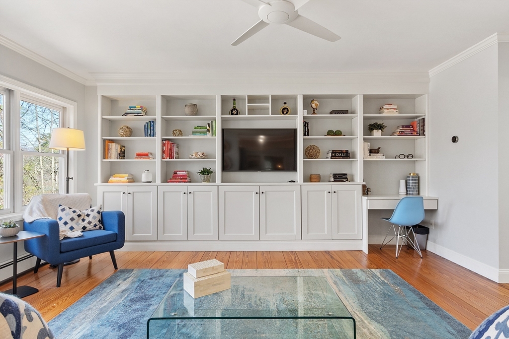 4 Willow Road Harvard, MA 01451 - Photo 17 of 42 a living room with furniture a rug and a bookshelf