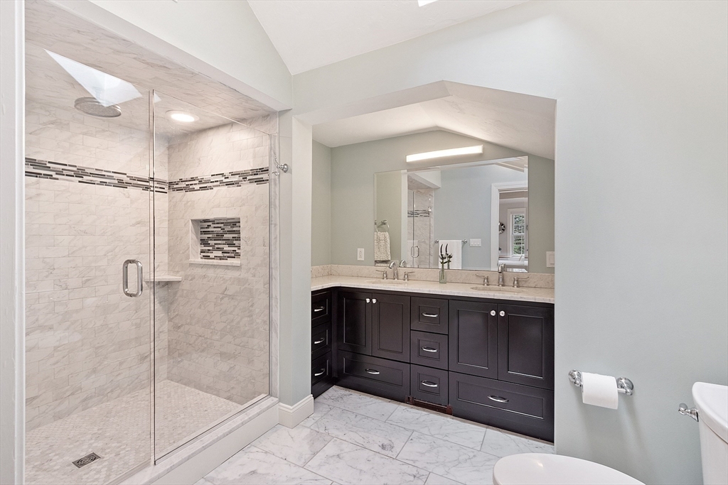 4 Willow Road Harvard, MA 01451 - Photo 22 of 42 a bathroom with a sink a toilet and shower