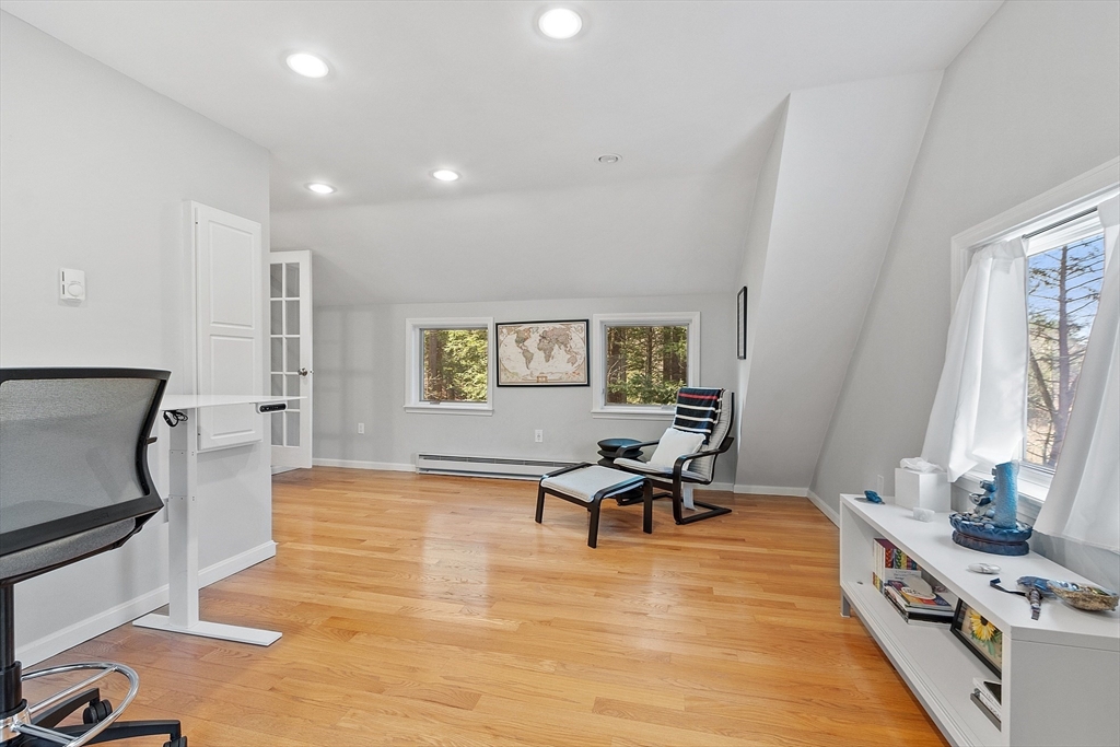 4 Willow Road Harvard, MA 01451 - Photo 24 of 42 a living room with furniture and a wooden floor