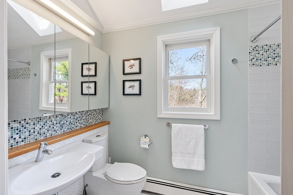 4 Willow Road Harvard, MA 01451 - Photo 28 of 42 a bathroom with a sink a toilet and shower