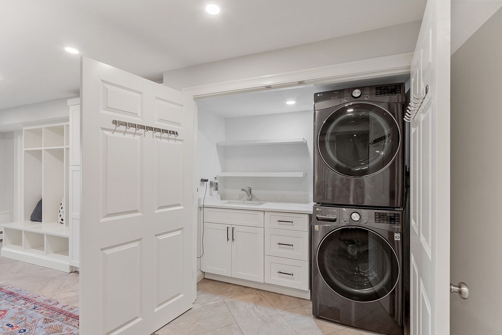 4 Willow Road Harvard, MA 01451 - Photo 31 of 42 a view of a hallway with washer and dryer