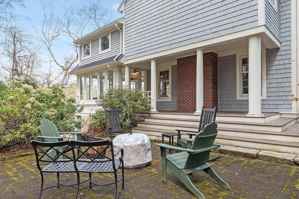 4 Willow Road Harvard, MA 01451 - Photo 37 of 42 a view of house with a chairs and table in a patio