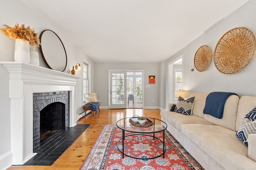 4 Willow Road Harvard, MA 01451 - Photo 6 of 42 a living room with furniture and a fireplace