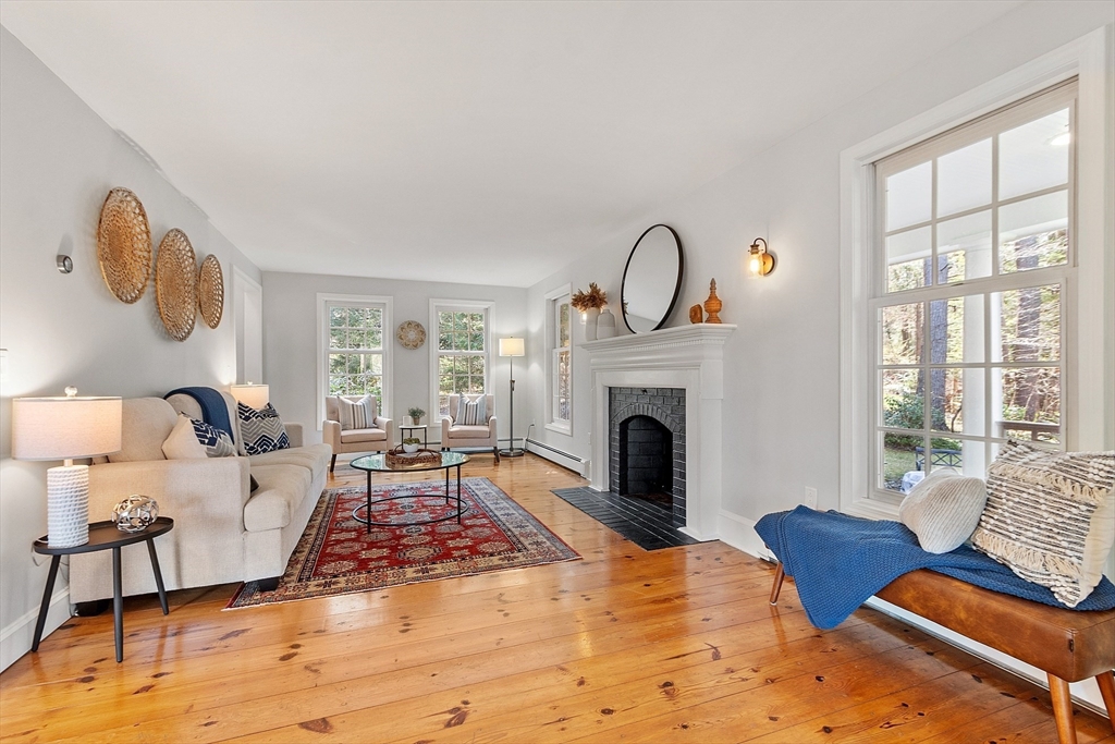 4 Willow Road Harvard, MA 01451 - Photo 7 of 42 a living room with furniture and a fireplace