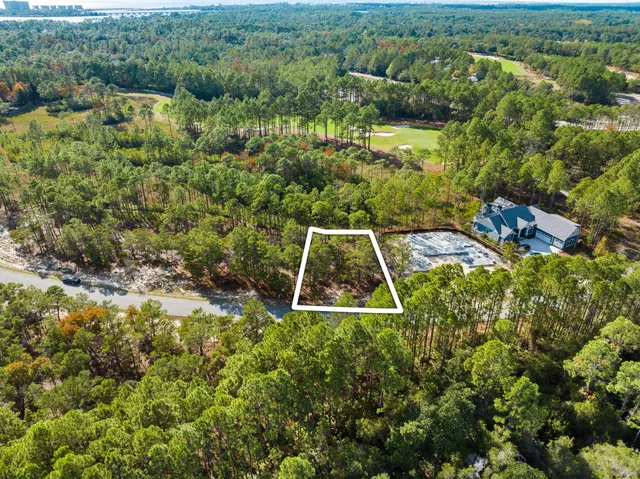 an aerial view of residential house with outdoor space and swimming pool