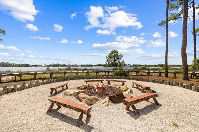 a view of a terrace with furniture and city view