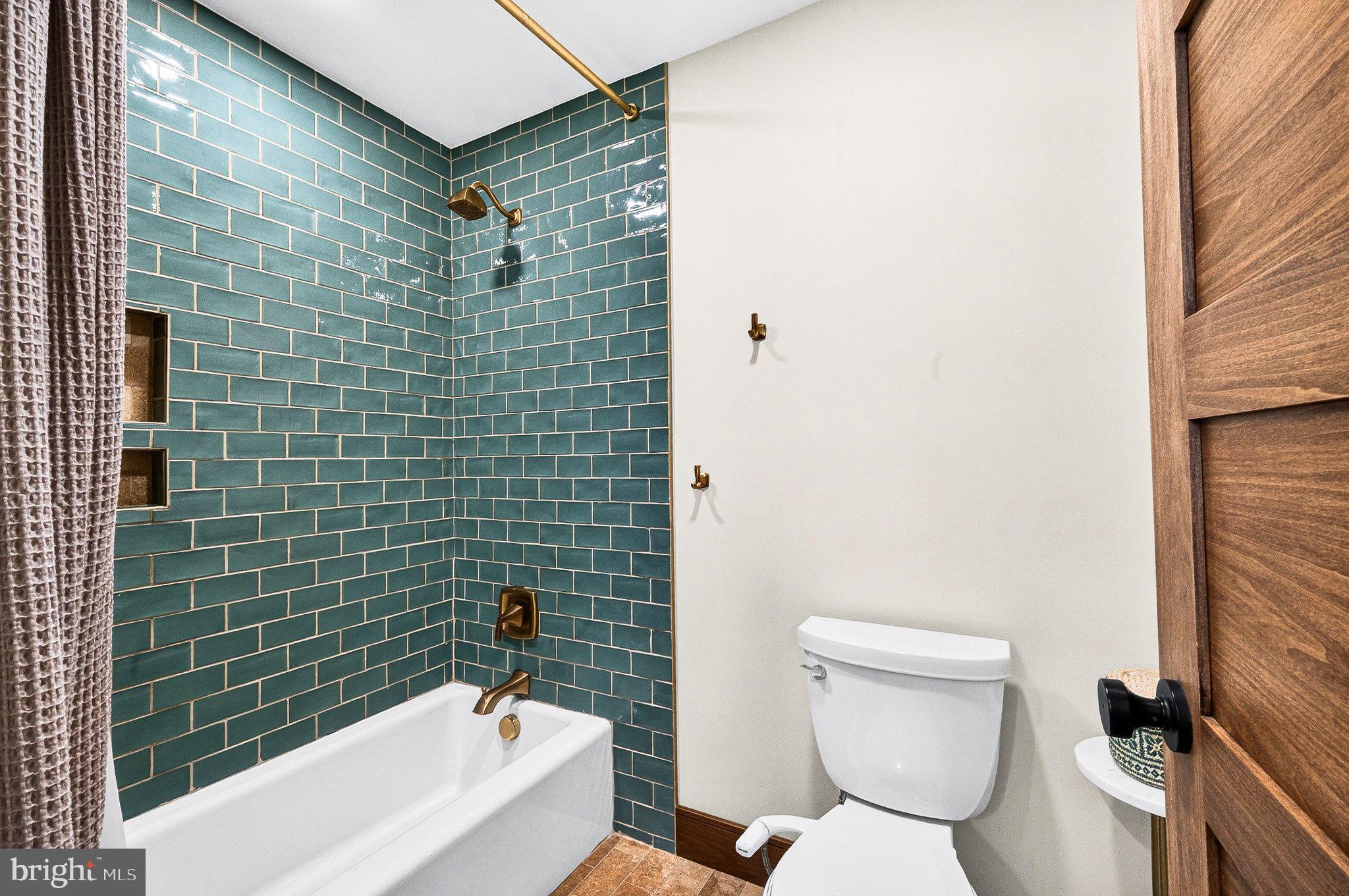 13311 Wilt Store Road Leesburg, VA 20176 - Photo 35 of 64 Chic bathroom with teal subway tiles.