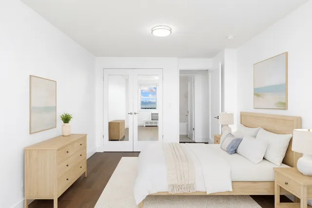 a bedroom with a bed and a dresser