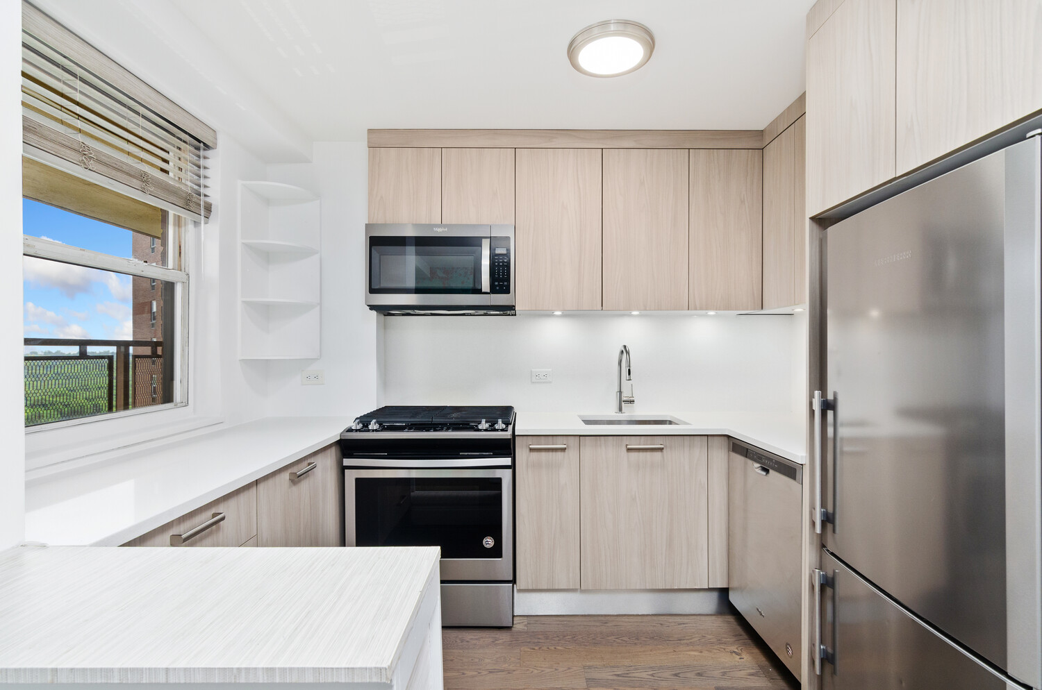 5700 Arlington Avenue, Unit 12T Bronx, NY 10471 - Photo 22 of 39 a kitchen with a refrigerator sink and microwave