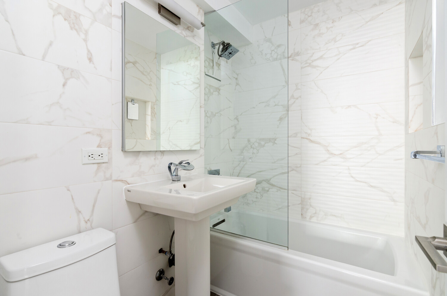 5700 Arlington Avenue, Unit 12T Bronx, NY 10471 - Photo 23 of 39 a bathroom with a sink a toilet and shower