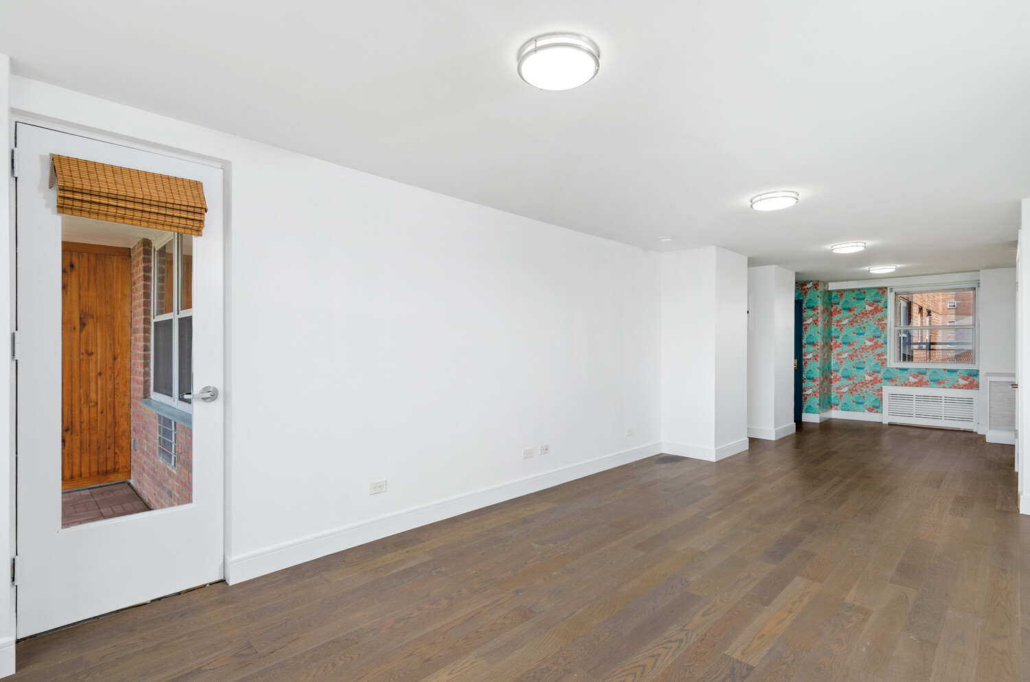 5700 Arlington Avenue, Unit 12T Bronx, NY 10471 - Photo 4 of 39 an empty room with wooden floor and a window