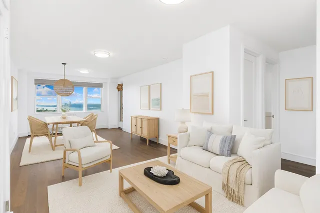 a living room with furniture and a table