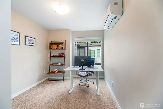 a living room with furniture a table and chair