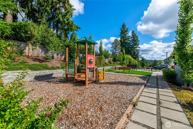a view of a backyard with sitting area