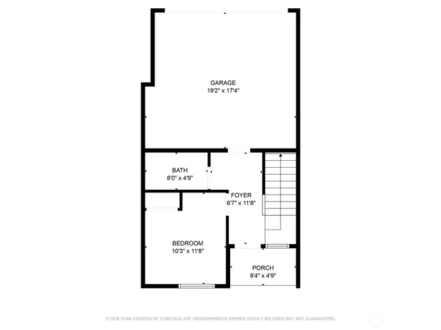 a picture of a bench in front of a wall