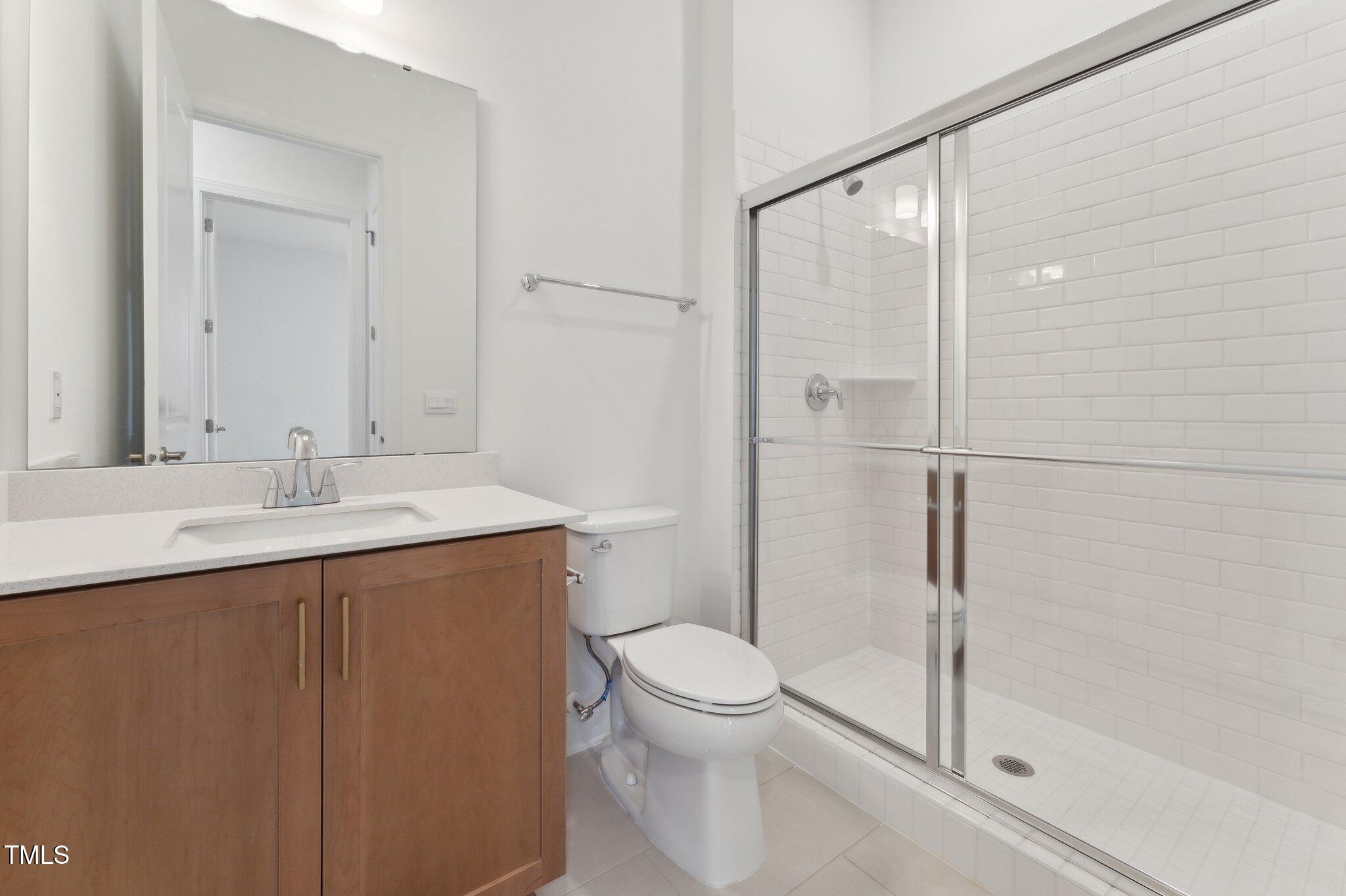 640 Gainer Drive, Unit 21 Raleigh, NC 27610 - Photo 21 of 27 a bathroom with a sink toilet and shower