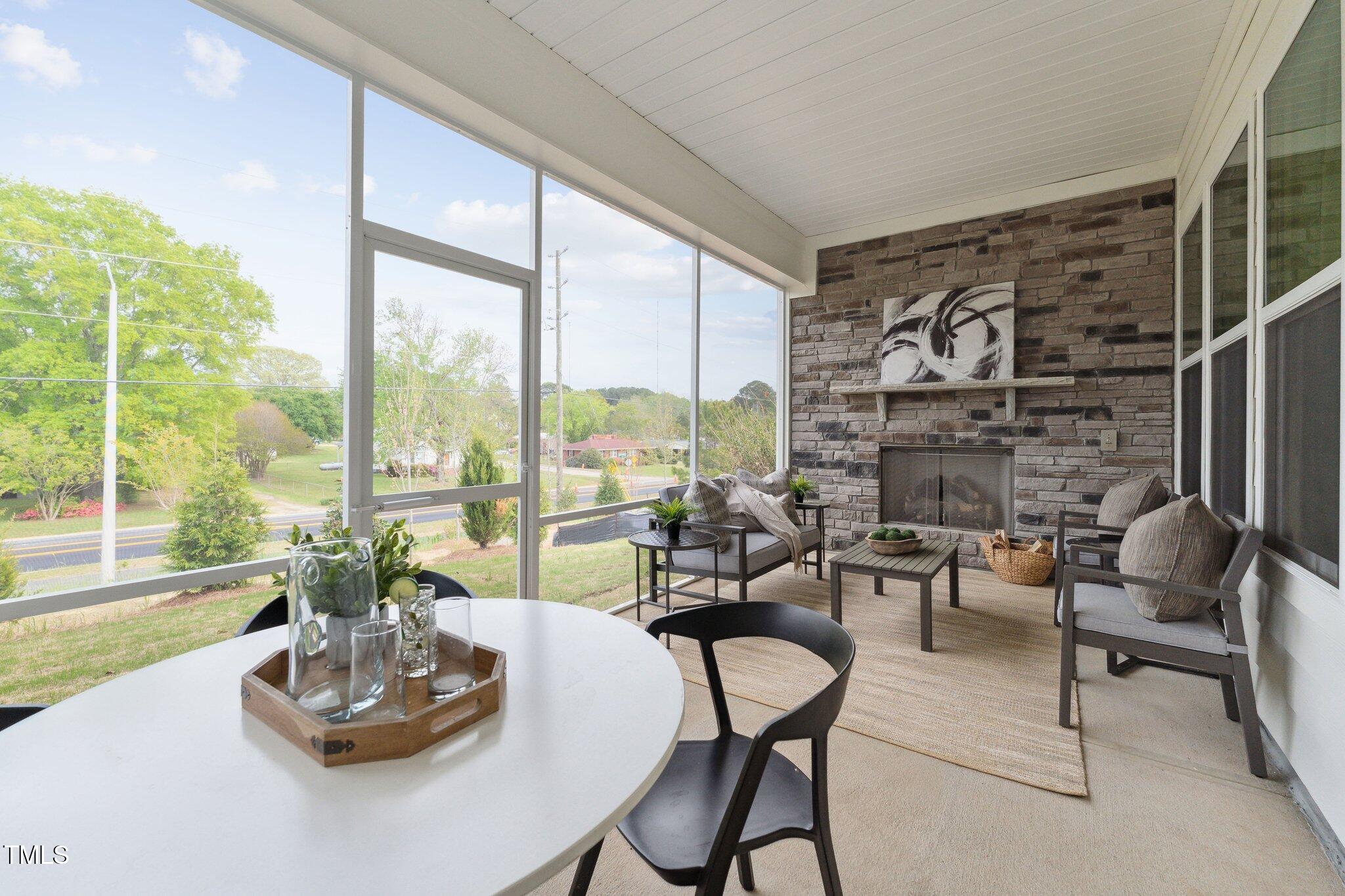 640 Gainer Drive, Unit 21 Raleigh, NC 27610 - Photo 24 of 27 a living room with furniture and a floor to ceiling window
