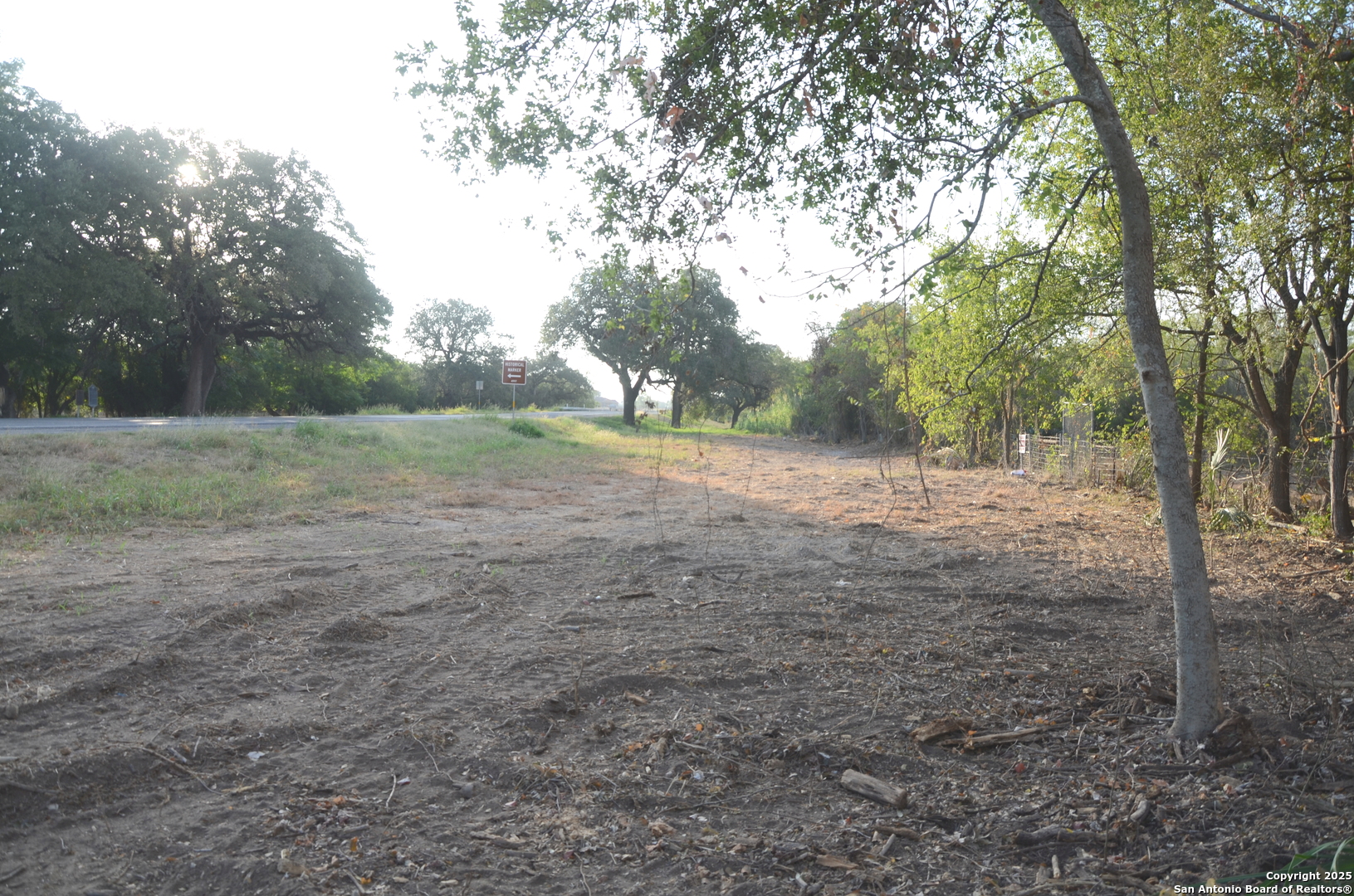 Tbd Highway 173 Devine, TX 78016 - Photo 2 of 5 a view of a field with trees in the background