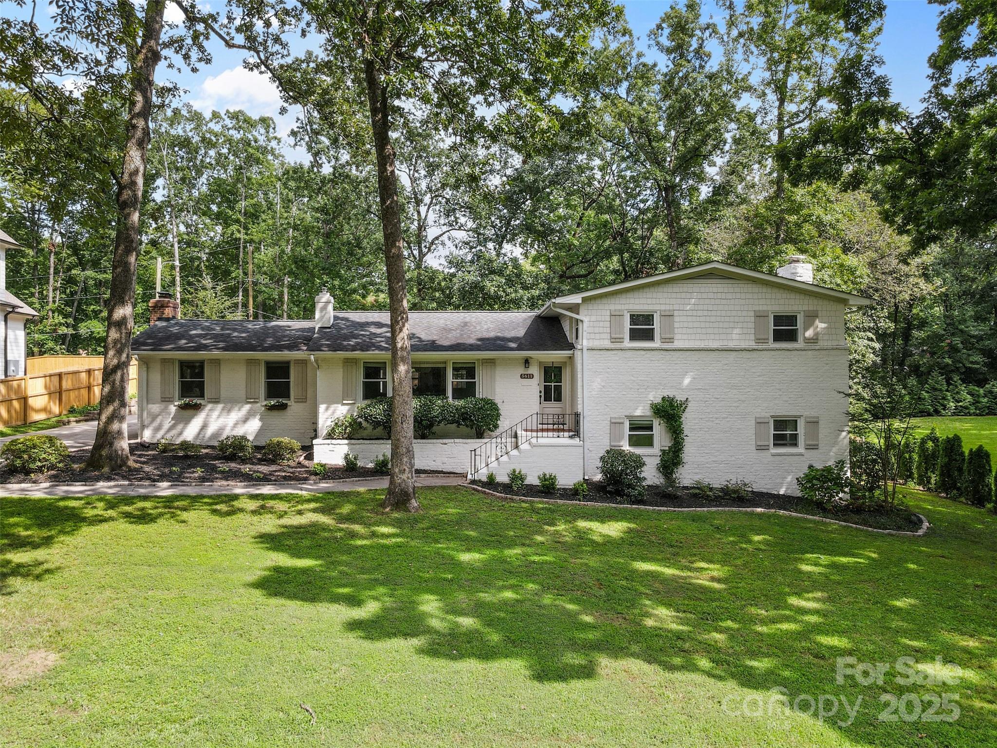 a front view of house with yard having outdoor seating