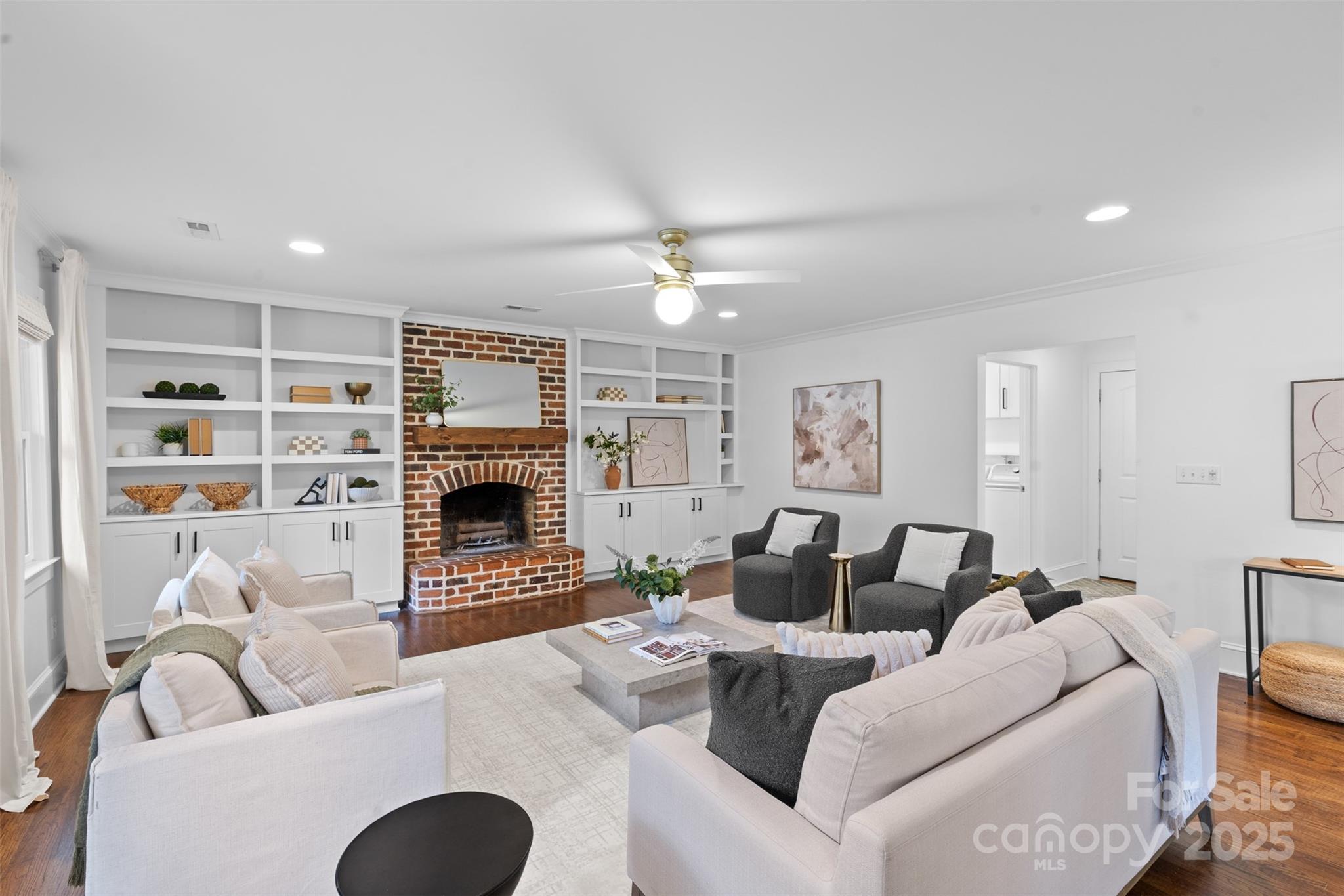 5611 Robinhood Road Charlotte, NC 28211 - Photo 13 of 48 a living room with furniture a fireplace and a flat screen tv