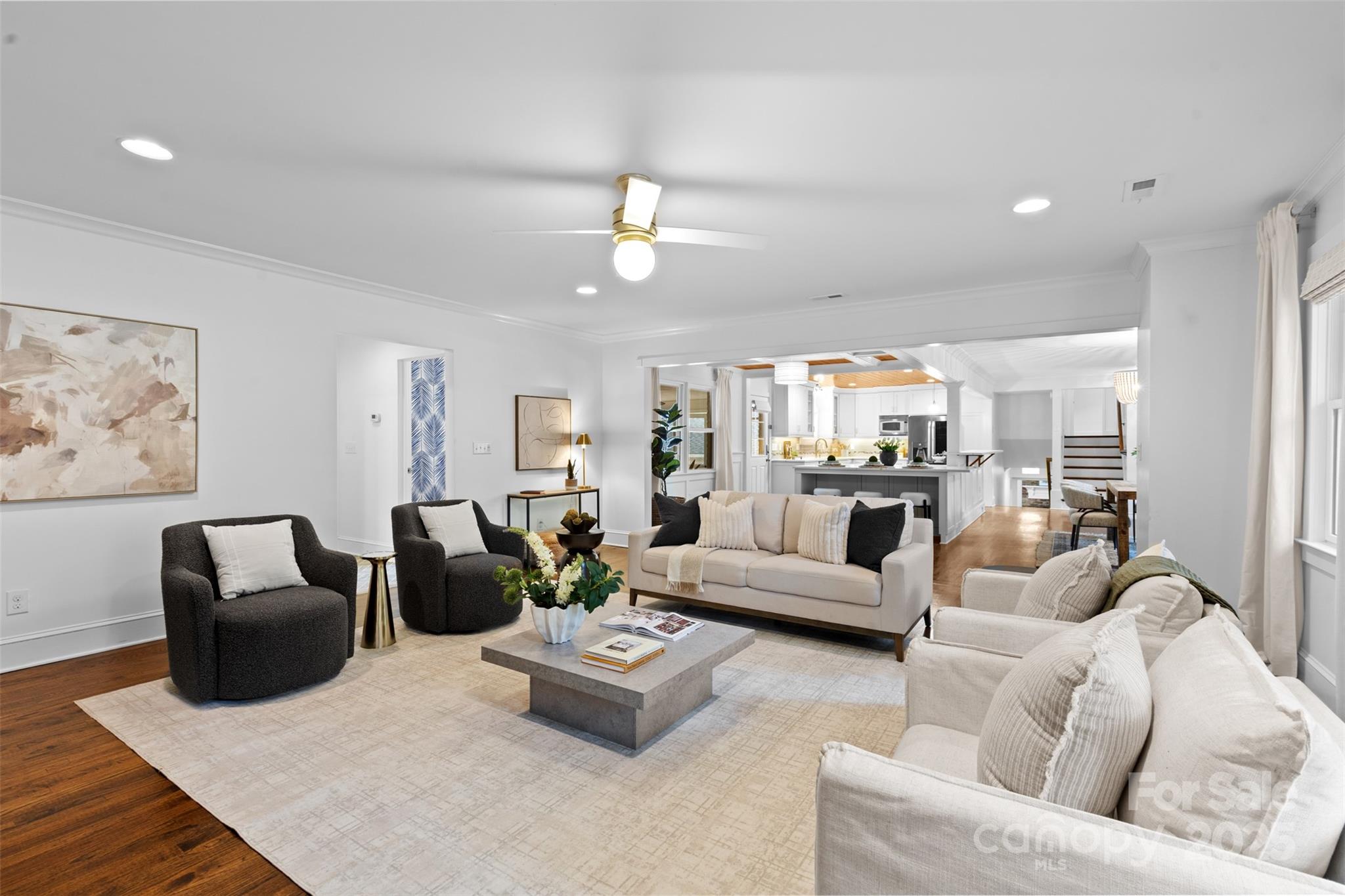 5611 Robinhood Road Charlotte, NC 28211 - Photo 16 of 48 a living room with furniture kitchen view and a chandelier