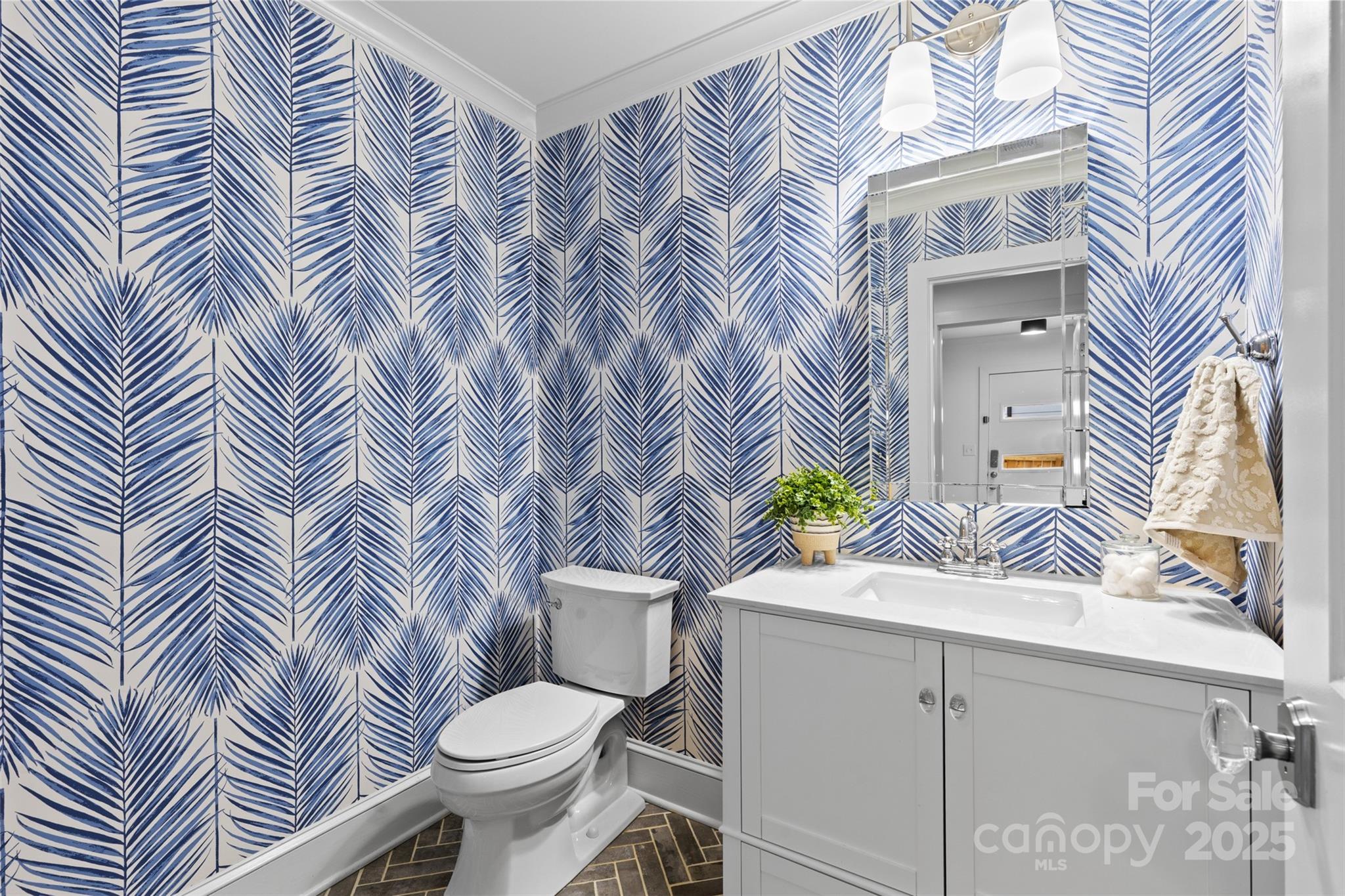 5611 Robinhood Road Charlotte, NC 28211 - Photo 17 of 48 a white toilet sitting next to a bathroom sink