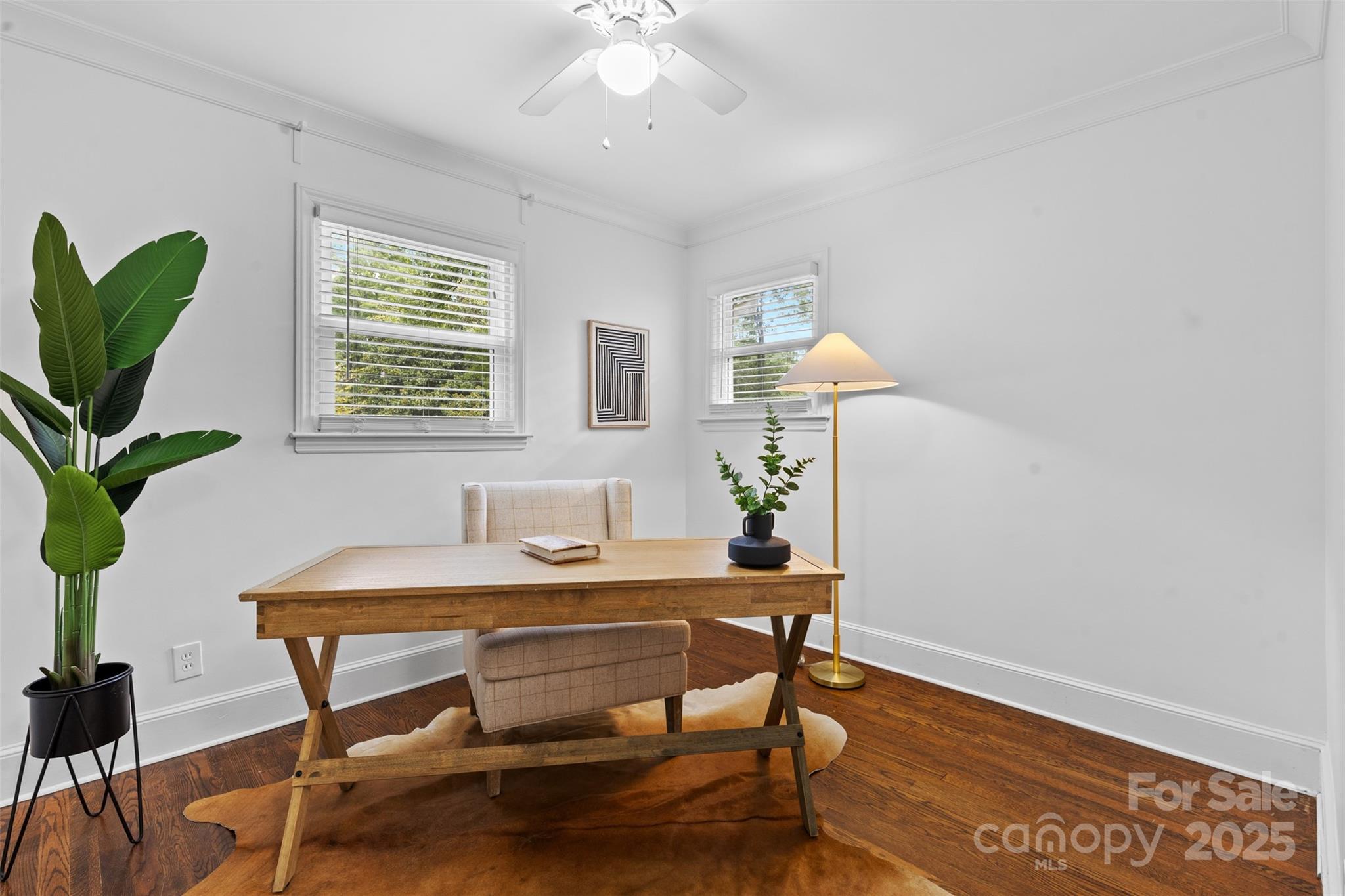 5611 Robinhood Road Charlotte, NC 28211 - Photo 19 of 48 a workspace with furniture and a potted plant