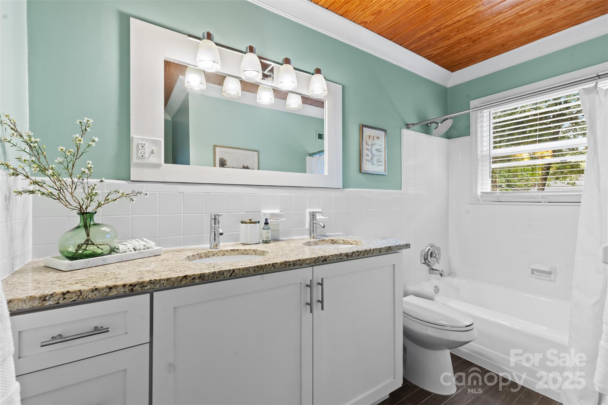 5611 Robinhood Road Charlotte, NC 28211 - Photo 20 of 48 a bathroom with a granite countertop toilet sink and mirror