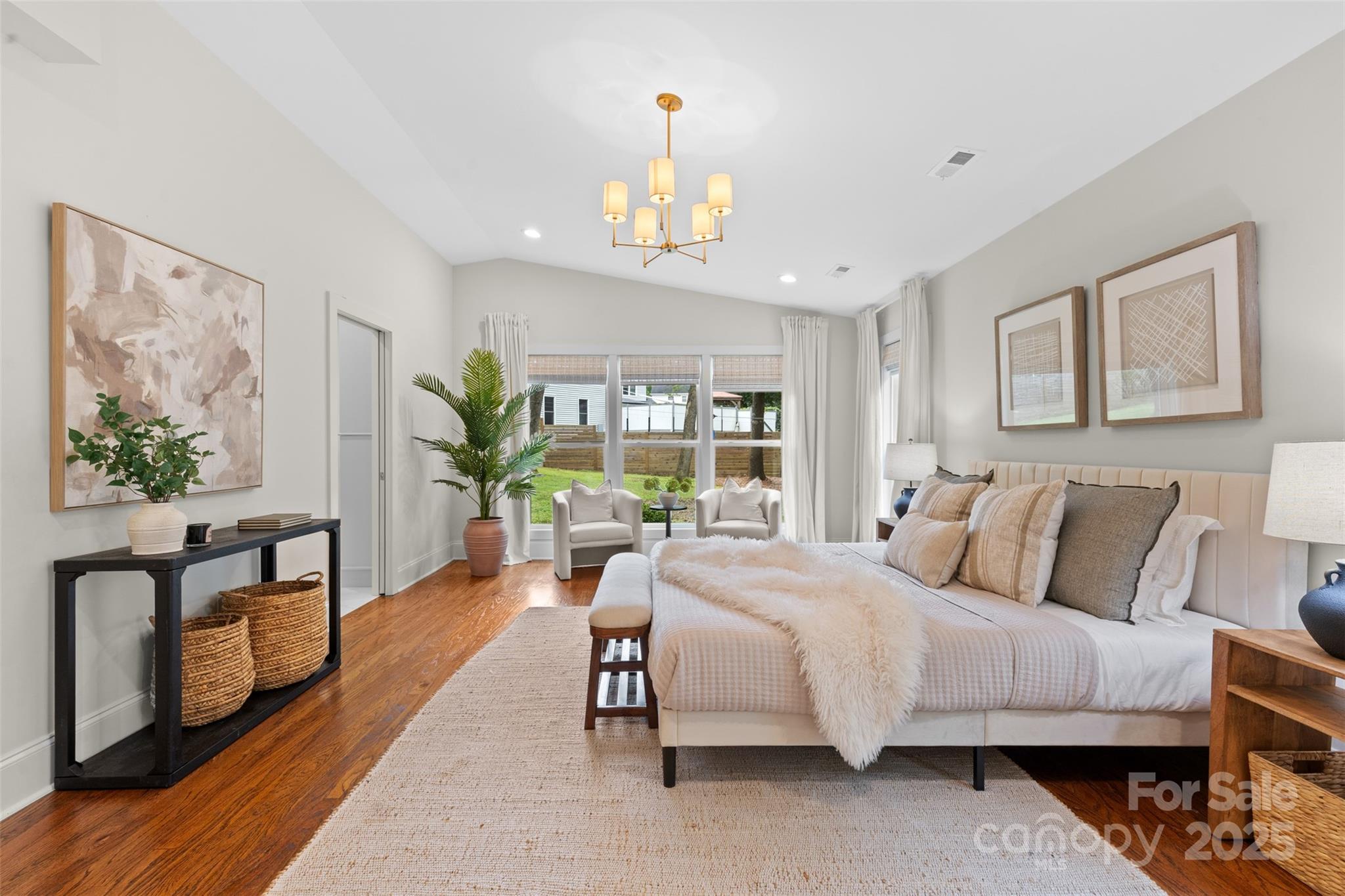 5611 Robinhood Road Charlotte, NC 28211 - Photo 27 of 48 a bedroom with a bed a dresser and next to a window