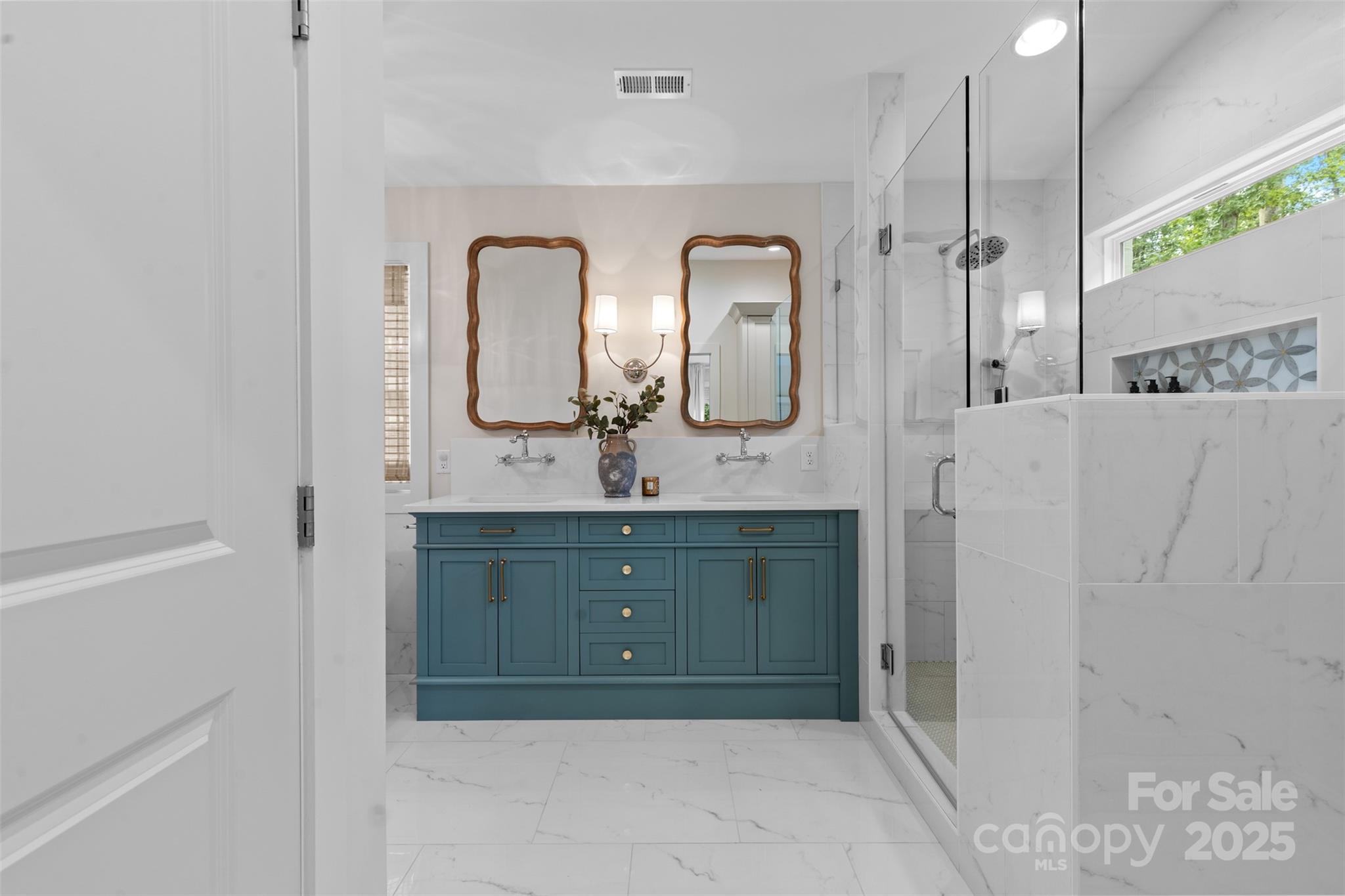 5611 Robinhood Road Charlotte, NC 28211 - Photo 29 of 48 a bathroom with a double vanity sink and mirror