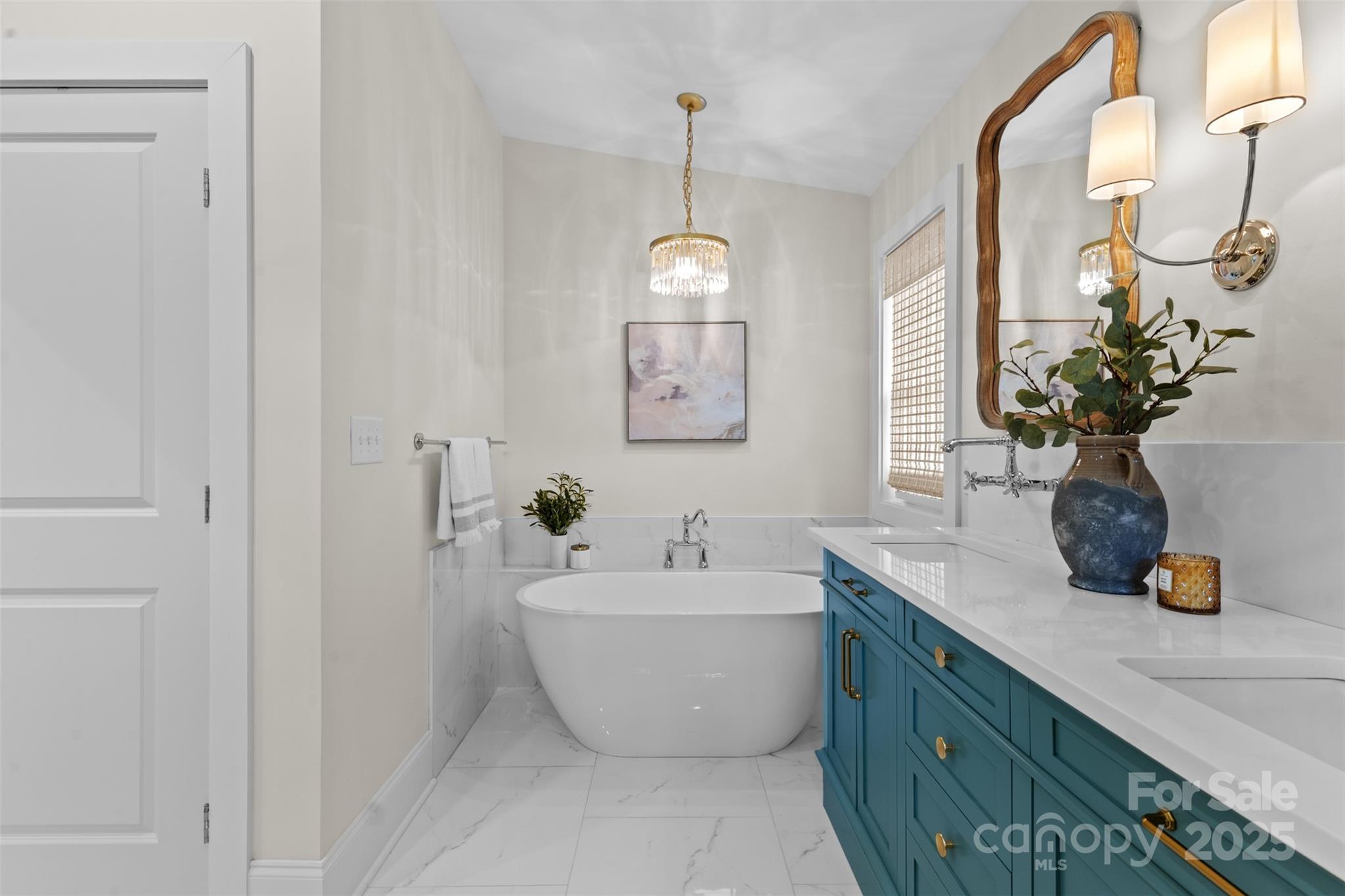 5611 Robinhood Road Charlotte, NC 28211 - Photo 31 of 48 a bathroom with a white tub sitting next to a window