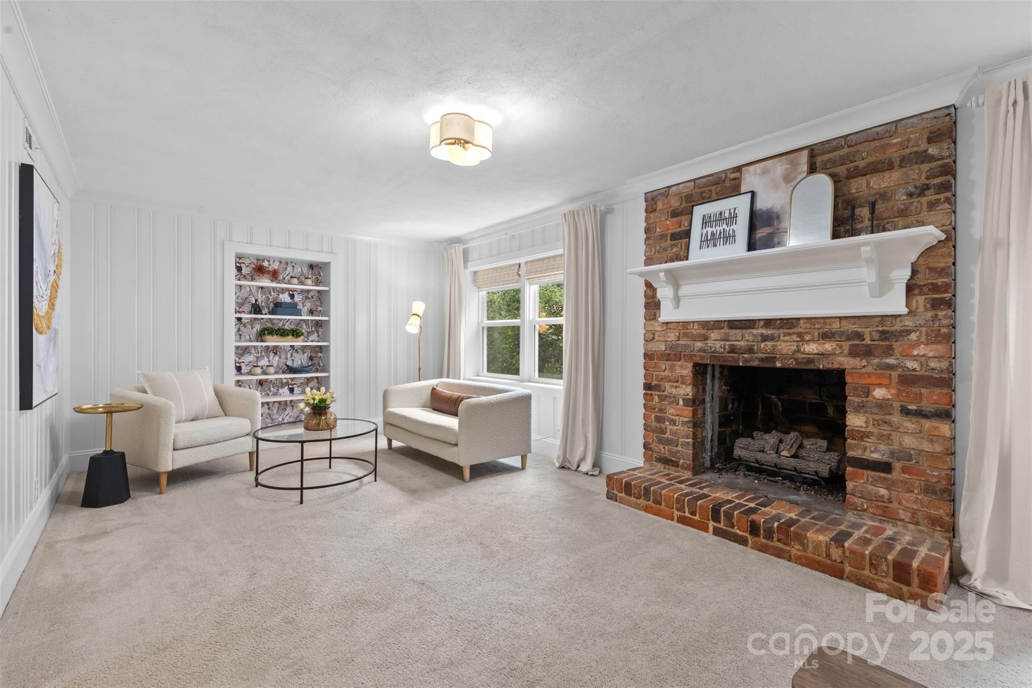 5611 Robinhood Road Charlotte, NC 28211 - Photo 37 of 48 a living room with furniture and a fireplace