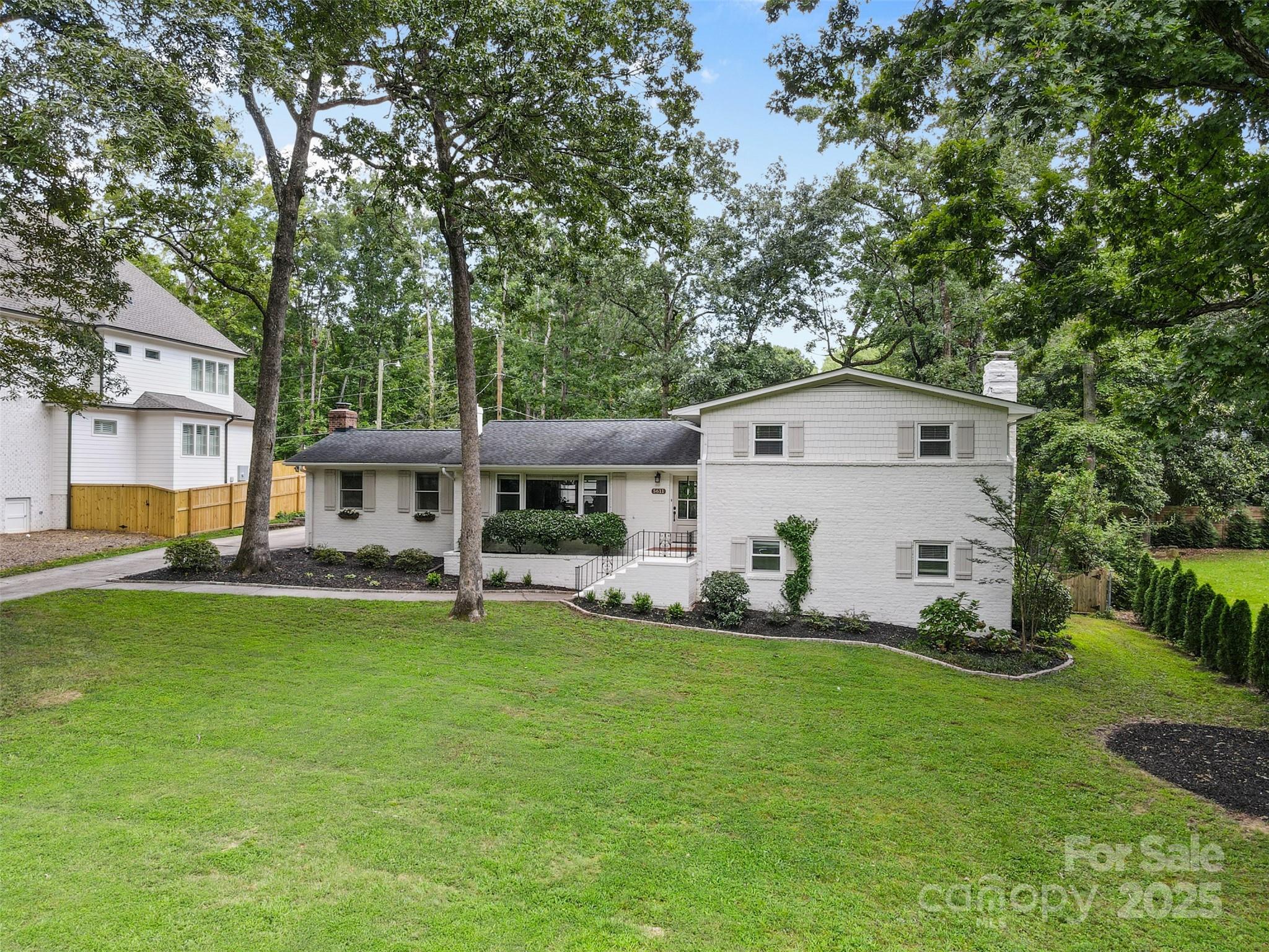 5611 Robinhood Road Charlotte, NC 28211 - Photo 48 of 48 a front view of a house with garden