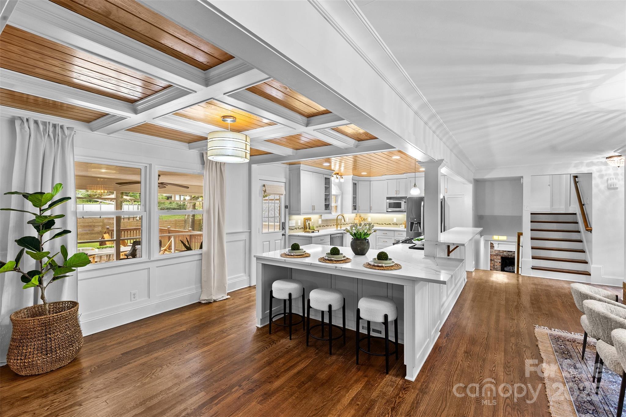 5611 Robinhood Road Charlotte, NC 28211 - Photo 7 of 48 a view of a dining room with furniture window and wooden floor