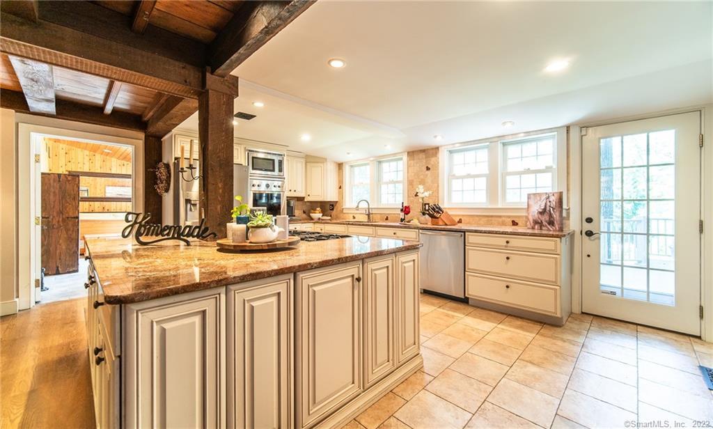 1447 Saybrook Road Haddam, CT 06438 - Photo 1 of 1 a kitchen with granite countertop a sink appliances cabinets and furniture