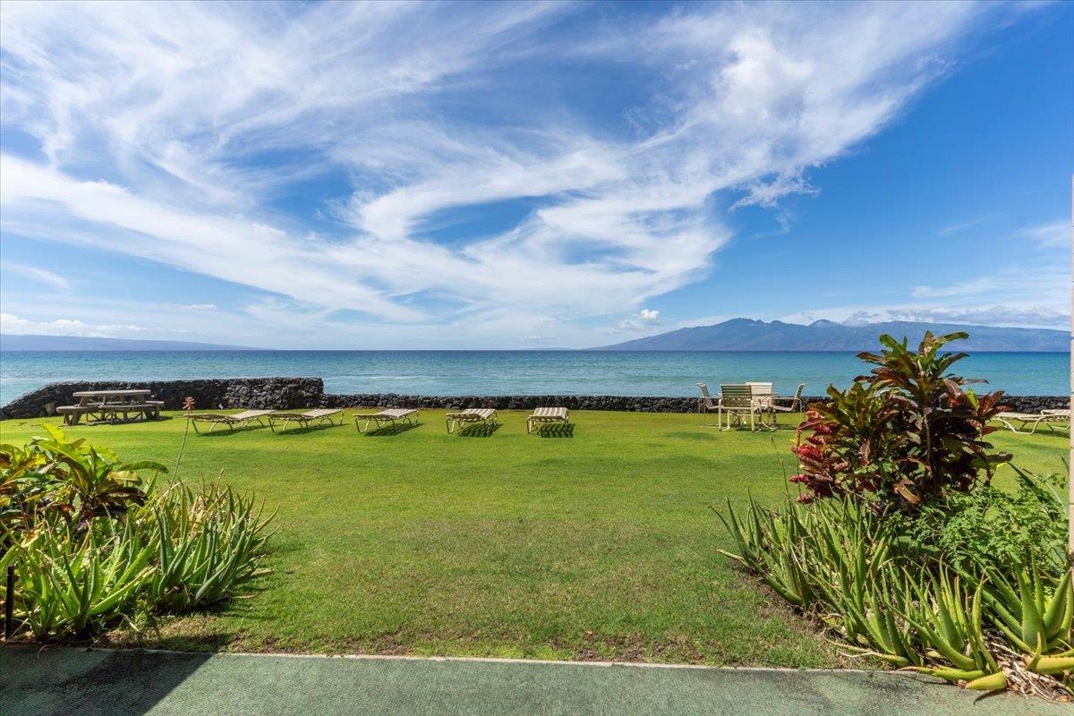 3785 Lower Honoapiilani Road, Unit 107 Lahaina, HI 96761 - Photo 20 of 30 a view of a swimming pool with an outdoor seating
