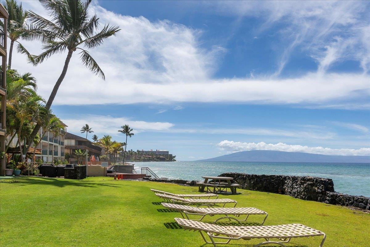 3785 Lower Honoapiilani Road, Unit 107 Lahaina, HI 96761 - Photo 24 of 30 a view of swimming pool with an ocean and trees in the background