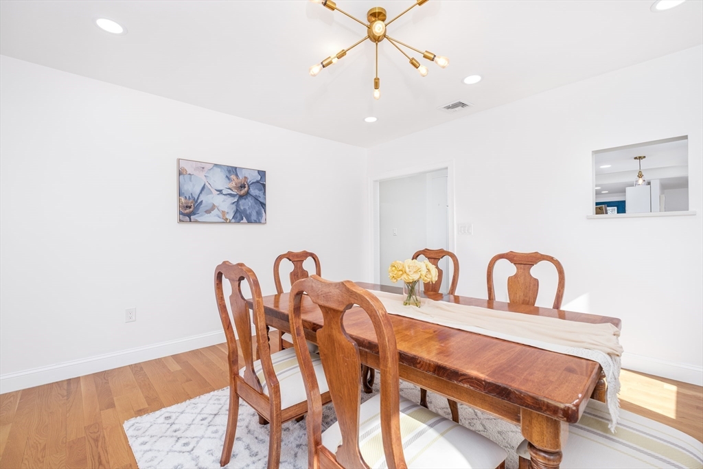33 Sargent Road Winchester, MA 01890 - Photo 12 of 42 a view of a dining room with furniture and wooden floor
