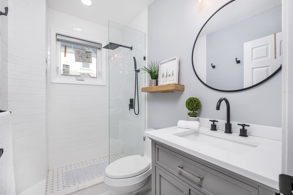 33 Sargent Road Winchester, MA 01890 - Photo 14 of 42 a bathroom with a sink mirror toilet and shower