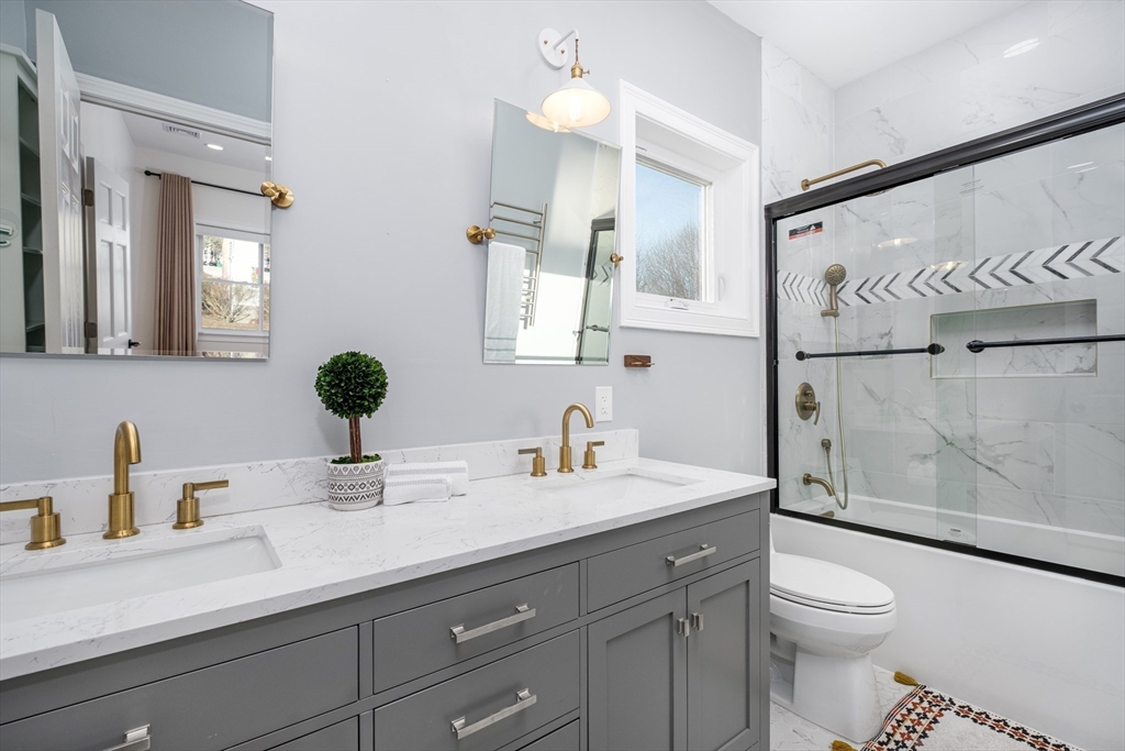 33 Sargent Road Winchester, MA 01890 - Photo 17 of 42 a bathroom with a sink a toilet and shower