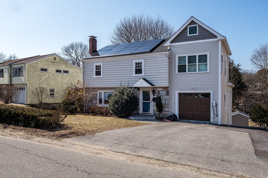 33 Sargent Road Winchester, MA 01890 - Photo 2 of 42 a front view of a house with a yard