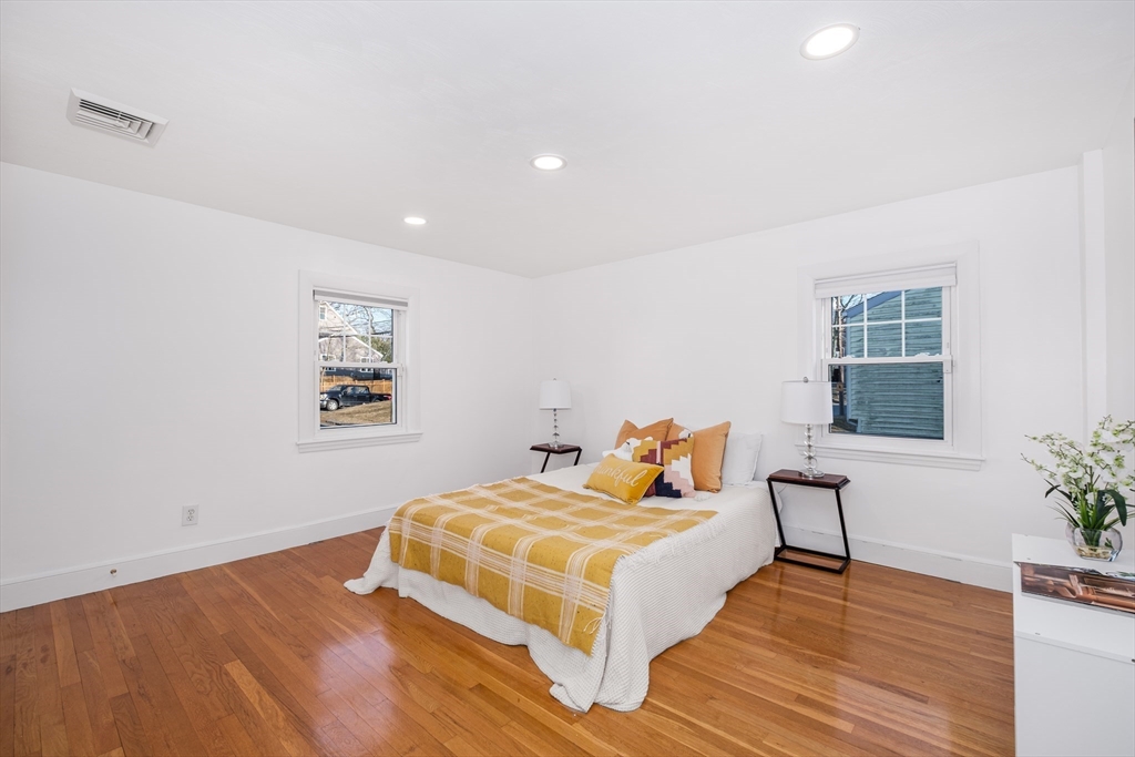 33 Sargent Road Winchester, MA 01890 - Photo 21 of 42 a bedroom with a bed and wooden floor