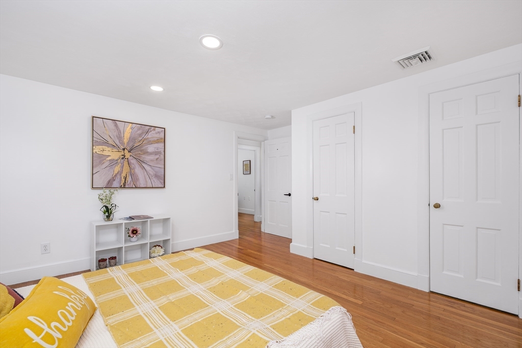 33 Sargent Road Winchester, MA 01890 - Photo 22 of 42 a bedroom with a bed and a painting on the wall