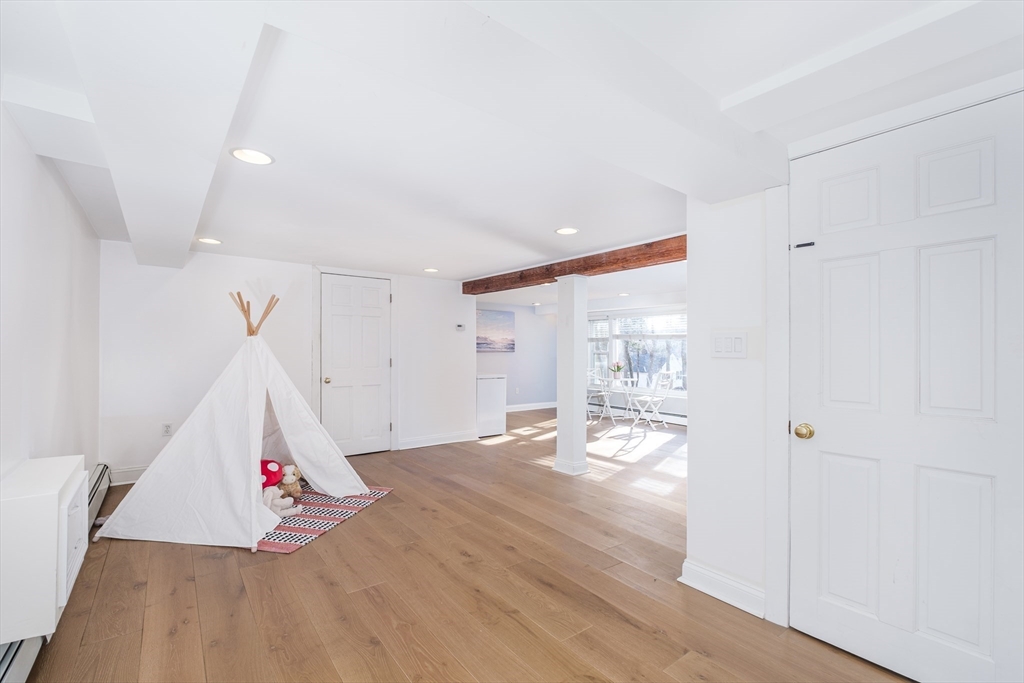 33 Sargent Road Winchester, MA 01890 - Photo 26 of 42 a view of an empty room and wooden floor
