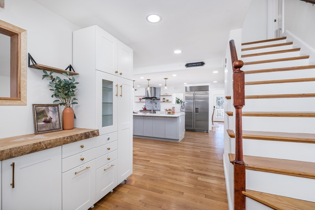 33 Sargent Road Winchester, MA 01890 - Photo 3 of 42 a kitchen with kitchen island cabinets and a sink