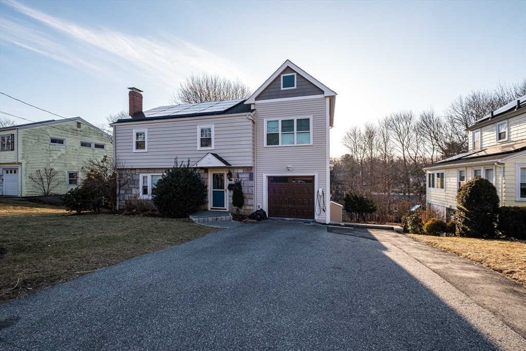 33 Sargent Road Winchester, MA 01890 - Photo 40 of 42 a front view of a house with a yard